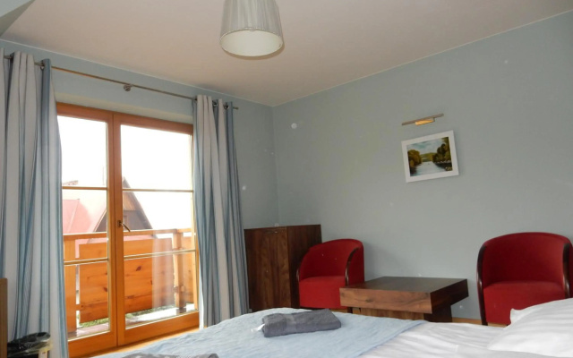 Domek za Strugiem - pokoje i apartamenty