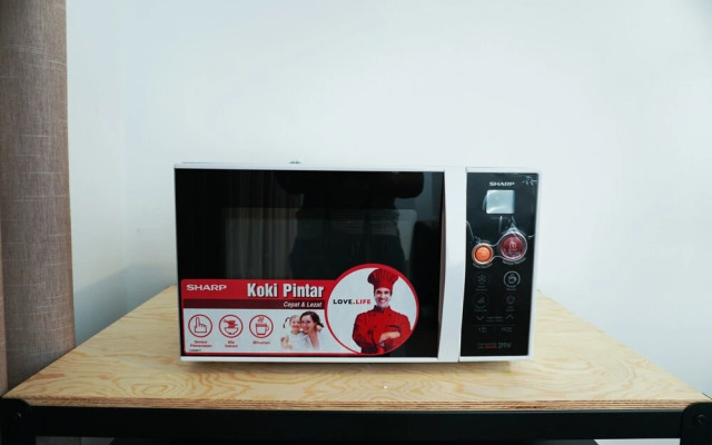 Elegant 1BR Veranda Residence @ Puri Apartment by Travelio