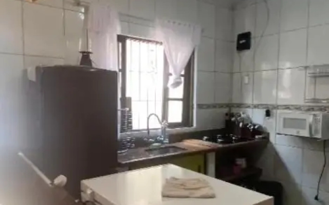 Casa com piscina próxima à cachoeira