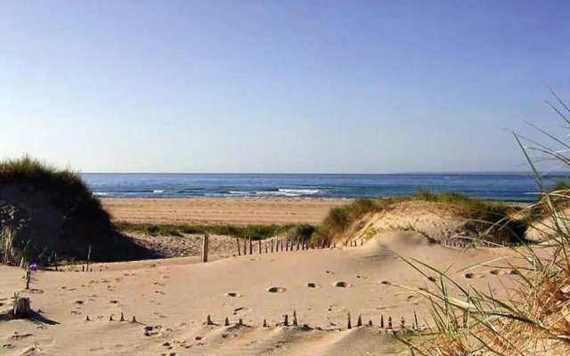 Wooden House by Beach Near Barneville