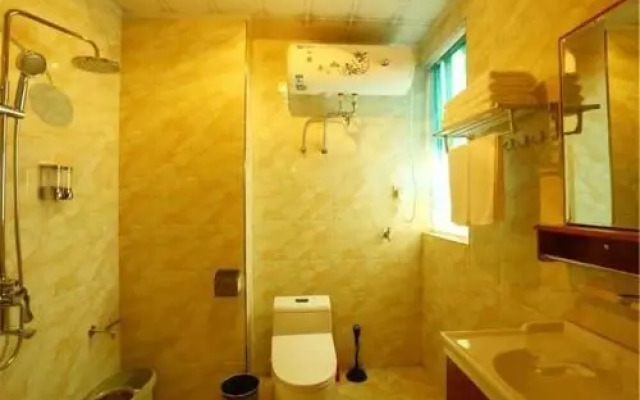 Huazhong Theme Apartment Hotel