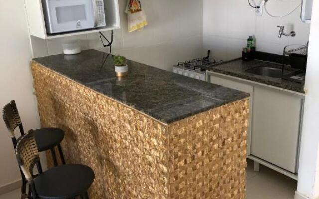 Village (Kitnet) com piscina, à 400mts da Praia.