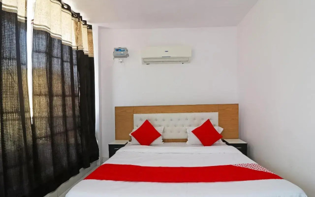 Red Carmine by OYO Rooms