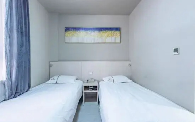 Linyi Mengnuo Hotel (University City bus station store)