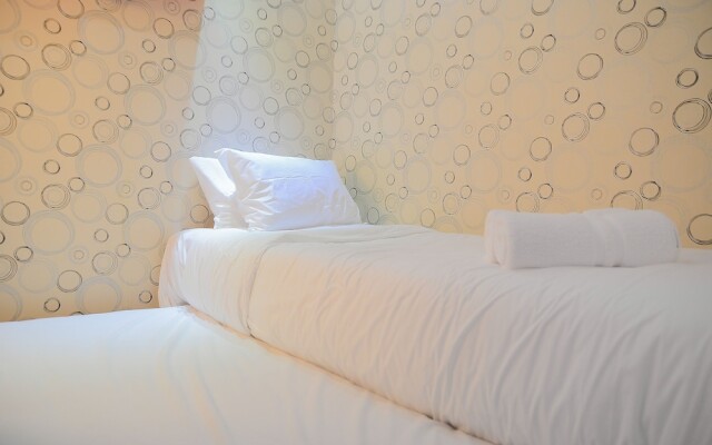 Homey and Relaxing 2BR Green Pramuka Apartment