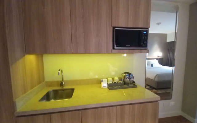 Capital O 950 Acqua Novotel Tower