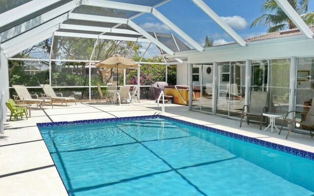 Cozy Home With Sunroom, Pool and Steps to Beach