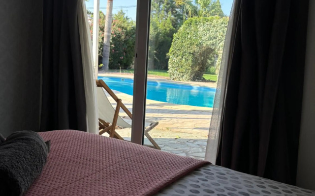 Mediterranean poolside garden cottage