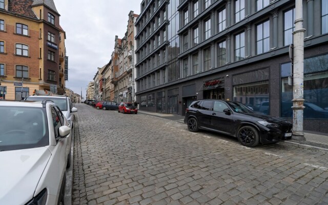 Studio centrum Poznań by Renters
