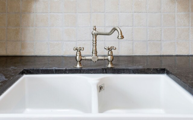 Cozy decorated house with fireplace, surrounded by forest