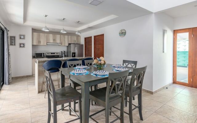 Ultramodern Townhome with an Inviting Coastal Design and Lush Outdoor Oasis with a Private Pool