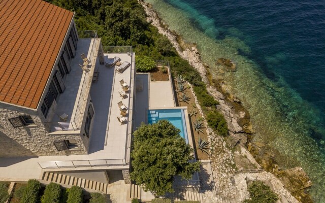 Beachfront Villa Poseidon with Heated Pool