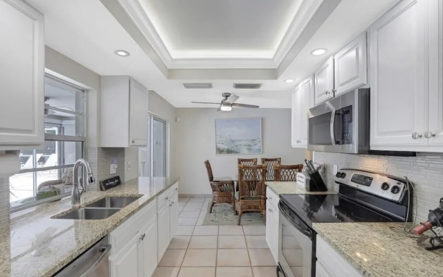 Cozy Home With Sunroom, Pool and Steps to Beach