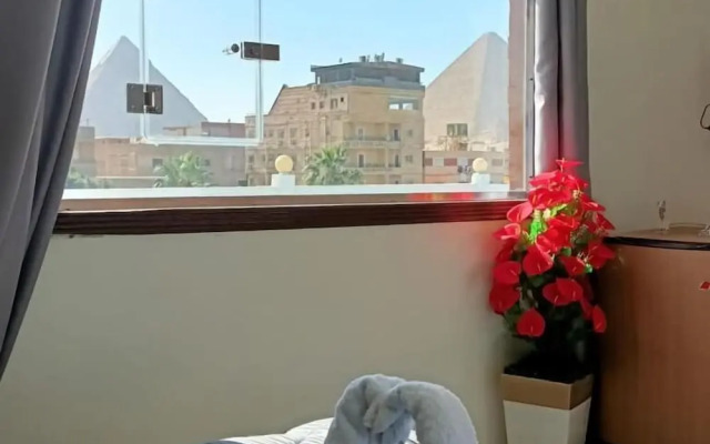 Nefertiti Pyramids View