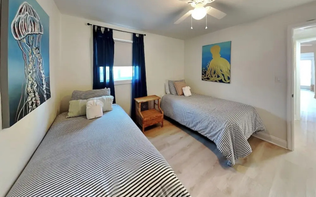 Bathing Suit Beach Bungalow by Distinctive Beach Rentals