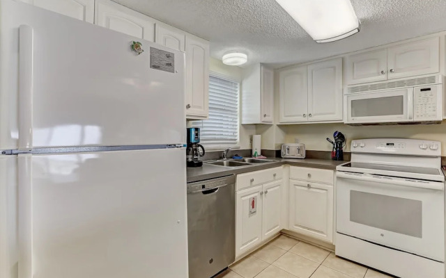 Oceanfront Beach Condo with Private Balcony, Short Walk to Pool and Beach by RedAwning