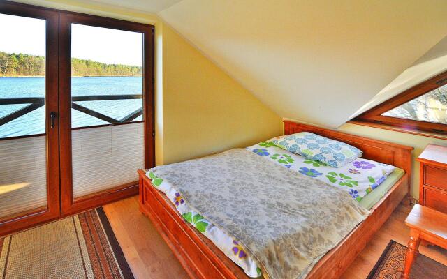Holiday Home by Lake Rosnowskie With Boat