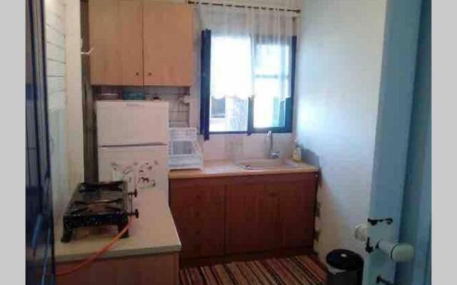 Wooden beach house / Nea Roda, Halkidiki