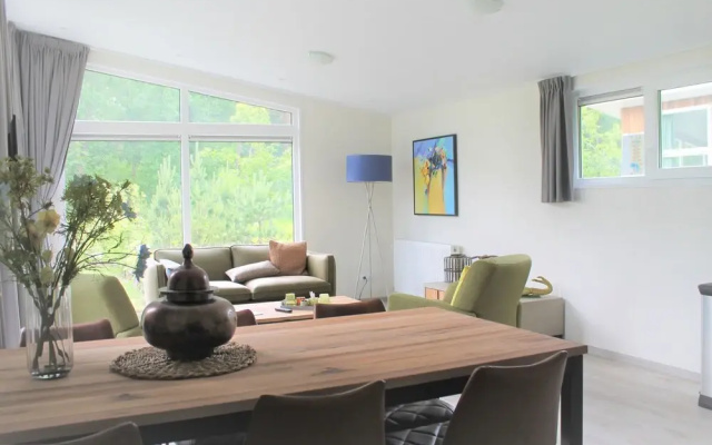 Modern chalet with a dishwasher, near a pond
