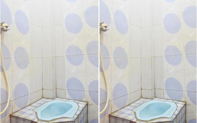 SPOT ON 91623 Pj Guest House Syariah