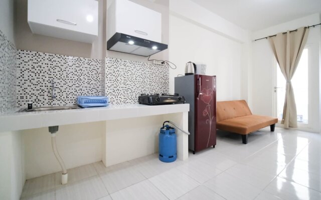 Cozy Living And Tidy 2Br At Puncak Dharmahusada Apartment