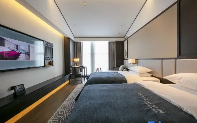 QIANNAHOTEL SPLENDOR（Zhengzhou East Railway Station Longzihu University District）