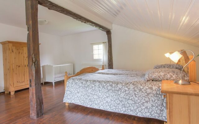 A Lovely Watermill Surrounded by Delightful Greenery