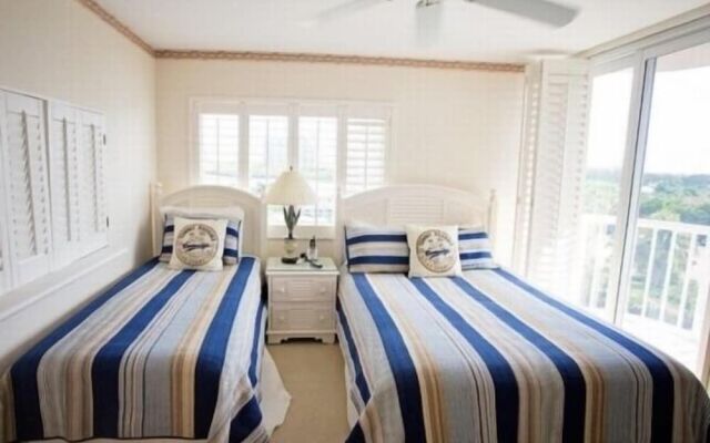 Cozy Condo with Gorgeous View of the Beach and Gulf by RedAwning