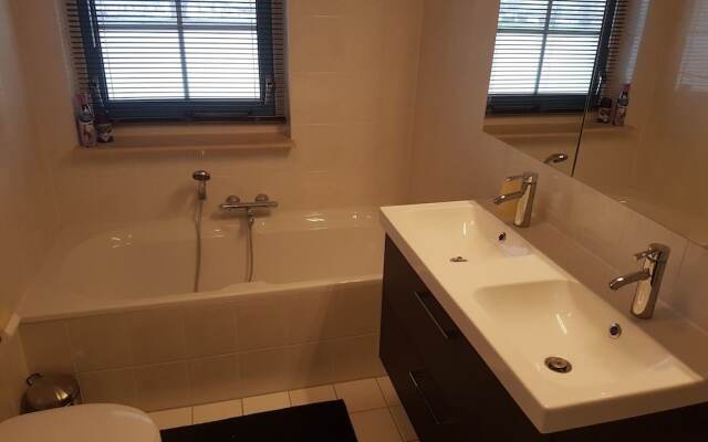 Exclusive Holiday Home Floating on a Lake in Friesland