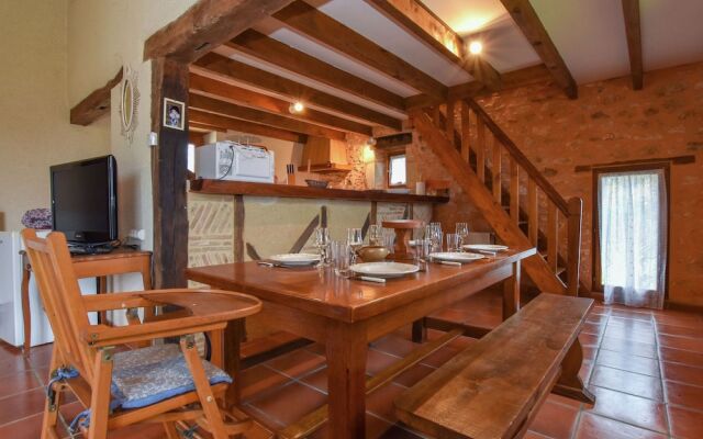 Lovely holiday home in Biron with fenced swimming pool