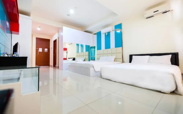 Family Studio Room at Ancol Mansion Apartment By Travelio