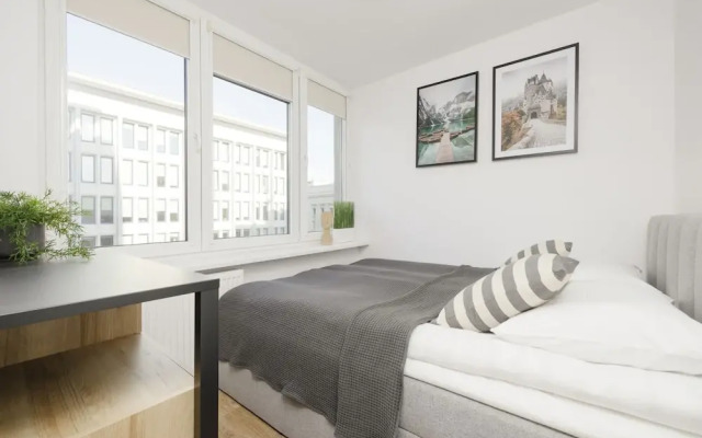 Grey Apartment Śródmieście by Renters