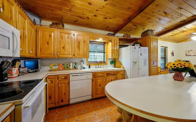 Cast Away Family Cabin with Hot Tub, Fireplace, and Kids Area by RedAwning