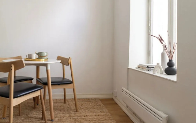 A bright wooden studio for four