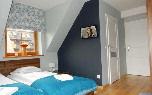 Domek za Strugiem - pokoje i apartamenty