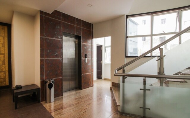 Capital O 15964 NI Ambaari Suites