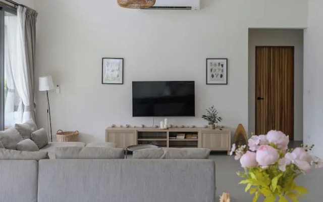 Tropical Poolside Retreat by Sea N' Rent