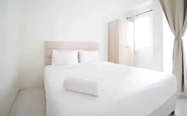 Tidy and Compact Studio at Puncak Dharmahusada Apartment By Travelio
