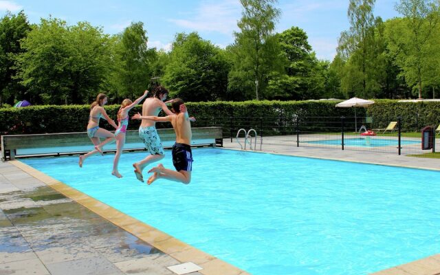 Cozy decorated house with fireplace, surrounded by forest