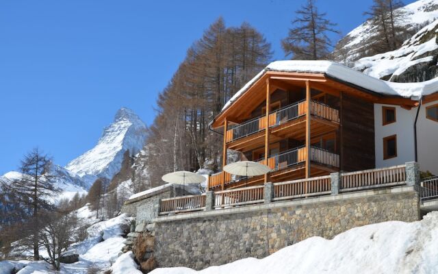 Mountain Exposure Luxury Chalets & Penthouses & Apartments