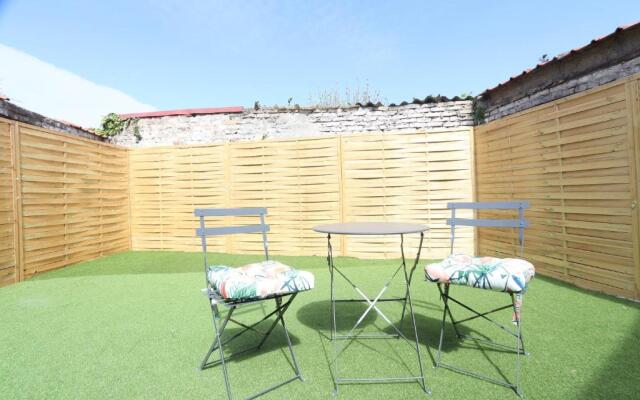 Coeur de ville, T2 cosy & élégant avec jardin