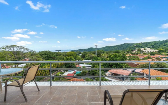 Modern Top-Floor Condo with Panoramic Views and Community Pool