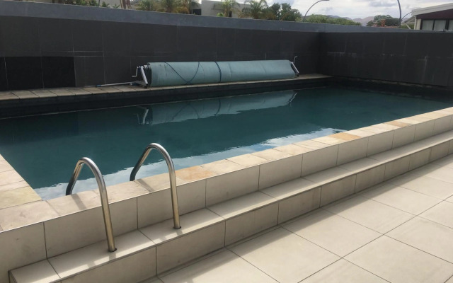 Highrise Windhoek apartment with skyline view, pool and gym