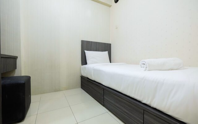 Monochrome Style 2 Bedrooms at Kalibata City Apartment By Travelio