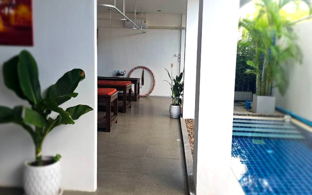 One World One Home Naiharn Hotel