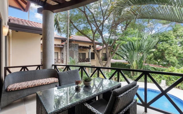 Modern Island-Themed Condo with Floor-to-Ceiling Windows & Garden and Pool Views Within Walking Distance of the Beach