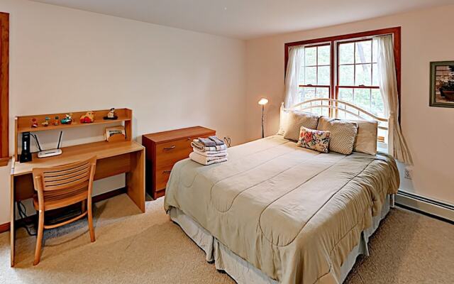 Woodsy Cape Cod Home by RedAwning