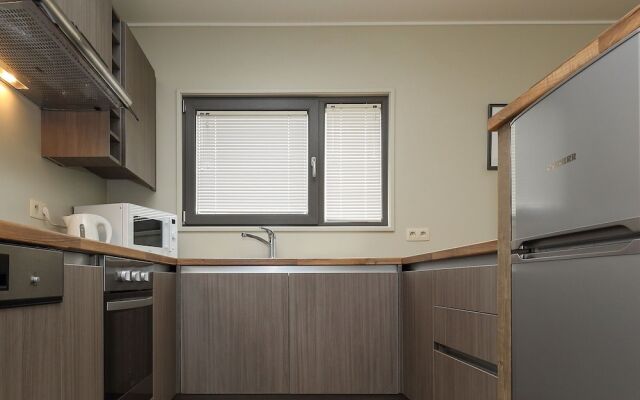 Child-friendly villa with stove, located in a lake area