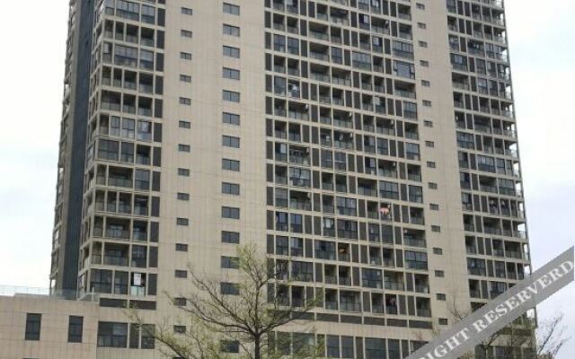 Xinyueju Boutique Apartment (Shishi Clothing City Shimao Skyscraper City Branch)
