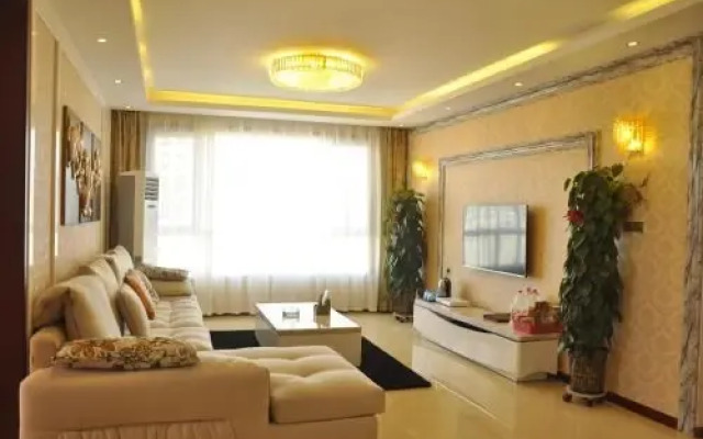 Huazhong Theme Apartment Hotel
